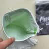 Cheeky Wipes opbergtasje met gaaszakje dat met de vuile doekjes in de wasmachine kan.
