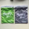 Cheeky Wipes Mucky Wet Bag voor het meenemen van vuile wasbare babydoekjes onderweg.