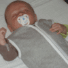 Baby met slaapzak van With a touch of Rose.