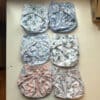 Blümchen wasbaar overbroekje met drukknopen van gerecycled polyester voor kinderen van 3 tot 15 kg
